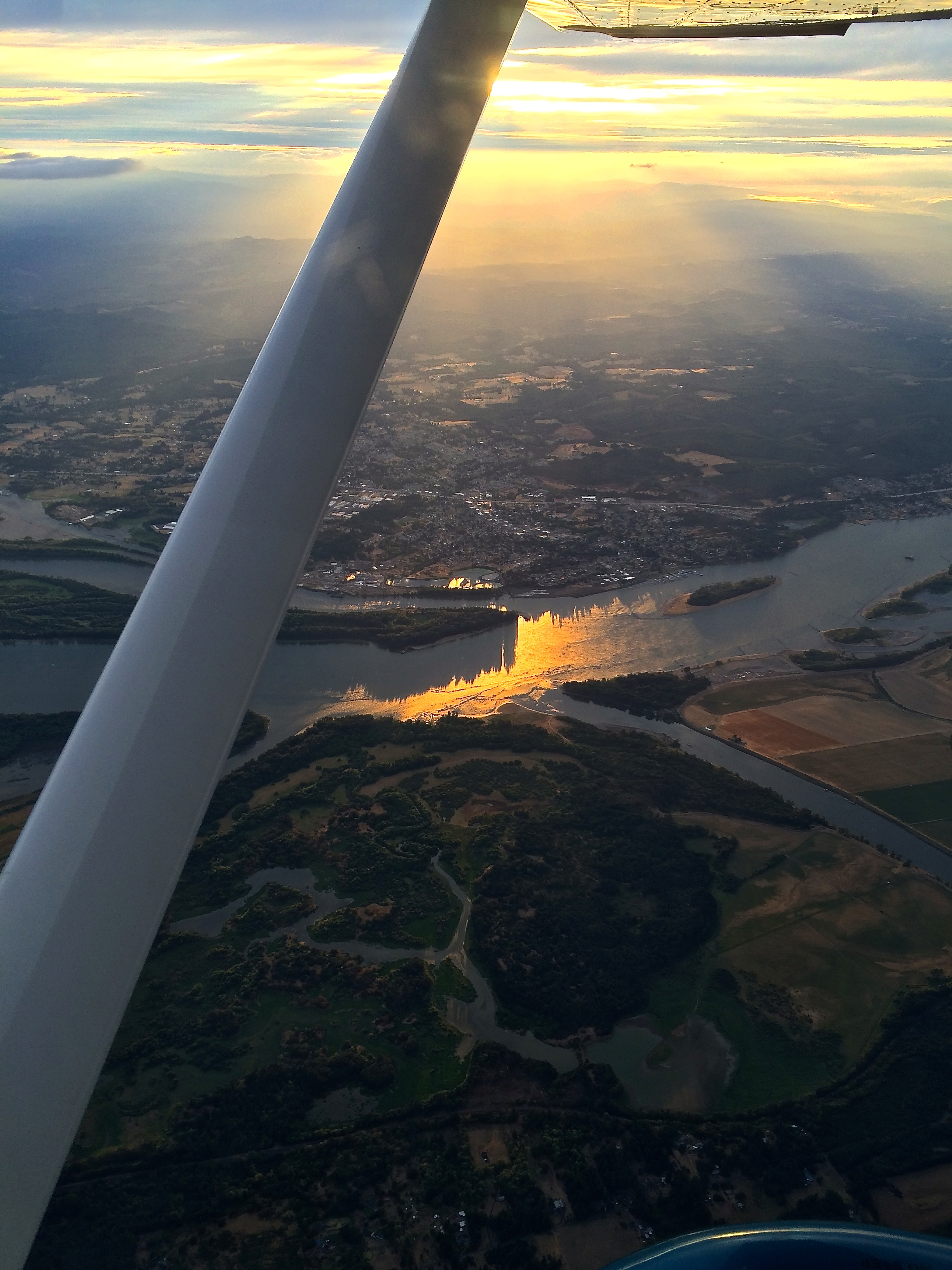 Photo of the town of St. Helens, Oregon and the Columbia River in the late afternoon sunlight.